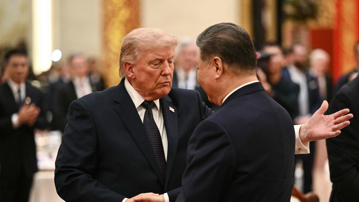 China's President Xi Jinping (R) and U.S. President Donald Trump shake hands as they attend a state banquet at the Great Hall of the People, Beijing, China, May 14, 2026. (AFP Photo)