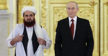 Russian President Vladimir Putin (R) and the Afghan Ambassador to Russia, Gul Hassan Hassan, attend a ceremony in Moscow, Russia, Jan. 15, 2026. (AP Photo)