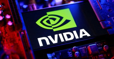 An Nvidia logo and a computer motherboard appear in this illustration taken Aug. 25, 2025. (Reuters Photo)