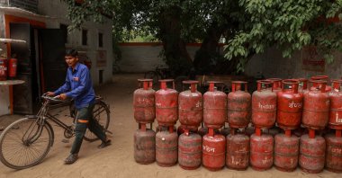 A worker walks past empty liquefied petroleum gas (LPG) cylinders to be refilled at a gas agency office in New Delhi, India, May 11, 2026. (EPA Photo)