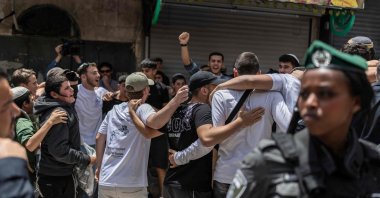 Police stand between Israeli settlers scuffling with left-wing activists in the Old City during a controversial march to mark East Jerusalem's occupation, May 14, 2026. (AFP Photo)