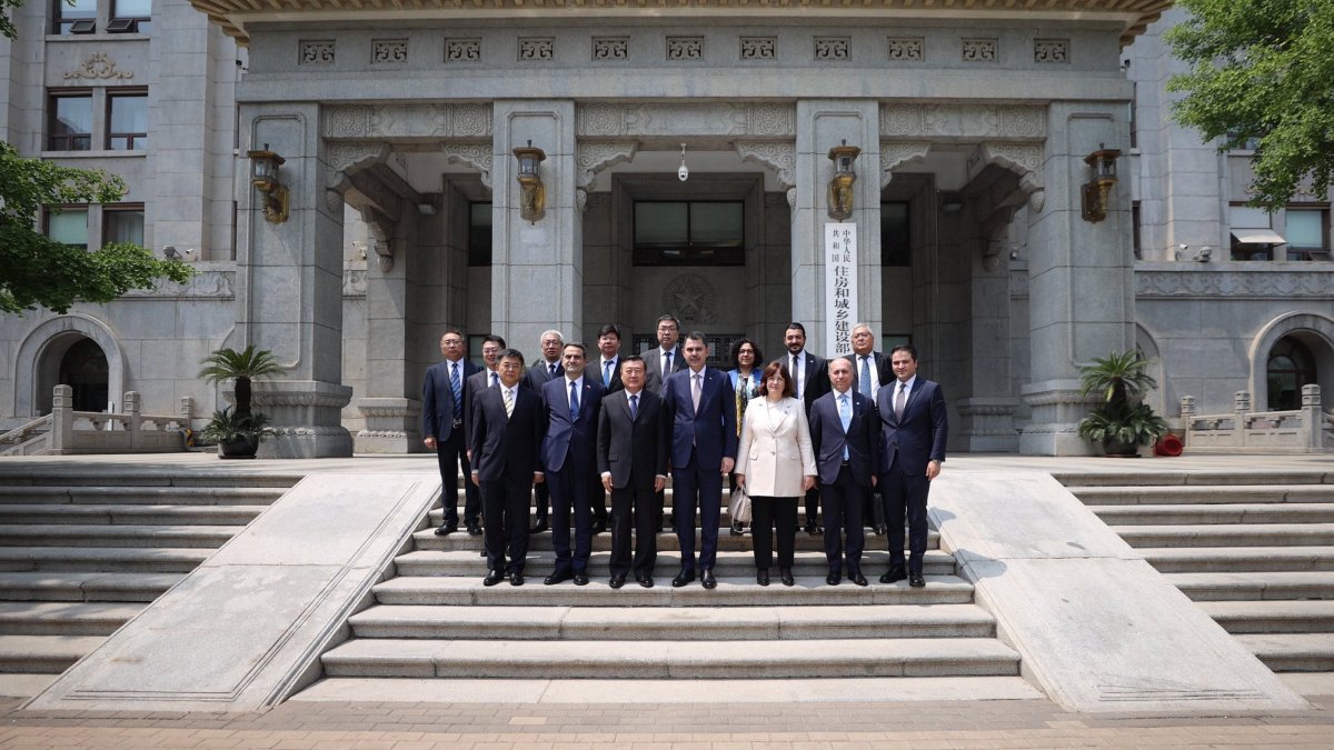 Environment, Urbanization and Climate Change Minister Murat Kurum (C-R) and China's Housing and Urban-Rural Development Minister Ni Hong (C-L) pose after a meeting, Beijing, China, May 13, 2026. (AA Photo)