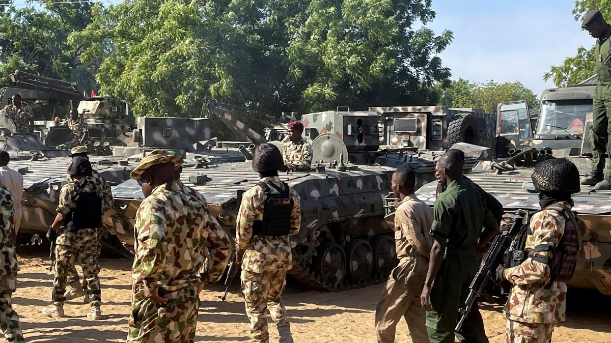 Nigerian soldiers walk past military tanks prepared for deployment during a tour of the Theatre Command Operation Lafiya Dole by Nigeria's Chief of Army Staff at Maimalari Cantonment in Maiduguri, Borno State, Nigeria, Nov. 7, 2025. (Reuters File Photo)