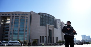 A police officer stands guard outside the Çağlayan courthouse, Istanbul, Türkiye, Feb. 6, 2024. (IHA File Photo)