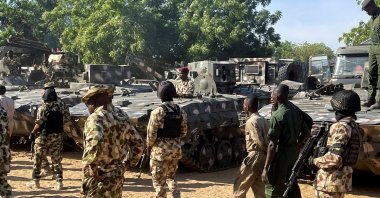Nigerian soldiers walk past military tanks prepared for deployment during a tour of the Theatre Command Operation Lafiya Dole by Nigeria's Chief of Army Staff at Maimalari Cantonment in Maiduguri, Borno State, Nigeria, Nov. 7, 2025. (Reuters File Photo)