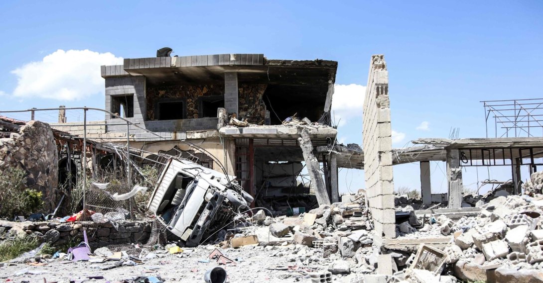 The debris of a destroyed building and vehicle litters the ground following a Jordanian strike on reported drugs and weapons storage facilities in the village of Busan, in the southern province of Suwayda, May 2, 2026. (AFP Photo)
