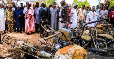 Adamawa State Governor Ahmadu Umaru Fintiri, left white hat, inspects an area that was attacked by Militants with the Daesh terrorist group, in Guyaku, northeastern Nigeria, April 27, 2026. (AP Photo)
