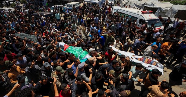 People carry bodies identified by mourners as Hamas' military wing commander Izz al-Din al-Haddad, his wife and his daughter, who were killed in an Israeli strike a day earlier, during a funeral, in Gaza City, May 16, 2026. (Reuters Photo)