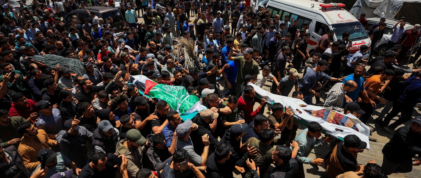 People carry bodies identified by mourners as Hamas' military wing commander Izz al-Din al-Haddad, his wife and his daughter, who were killed in an Israeli strike a day earlier, during a funeral, in Gaza City, May 16, 2026. (Reuters Photo)