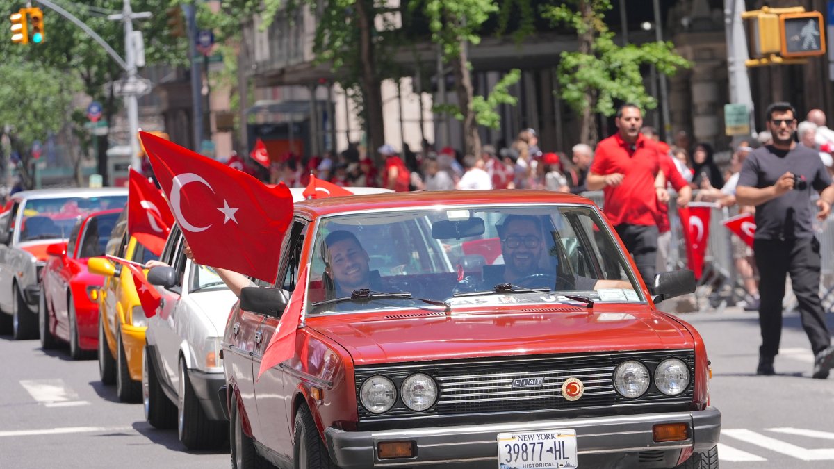 People wave Turkish flags during the 43rd Turkish Day Parade as Manhattan streets fill with celebrations and red-and-white colors, New York City, U.S, May 16, 2026. (AA Photo)