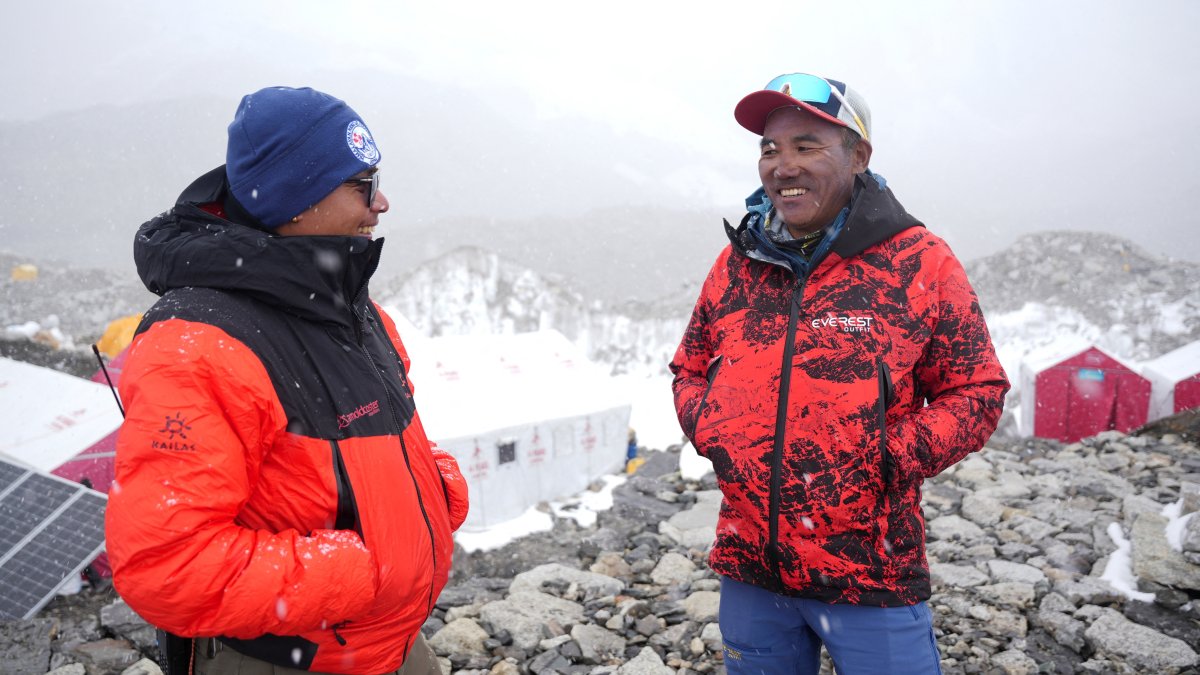 Kami Rita Sherpa (R), 55, smiles as he speaks with a friend at Everest Base Camp as he prepares to climb Everest for the 32nd time to break his own record, Everest region, Nepal, April 29, 2026. (Reuters Photo)