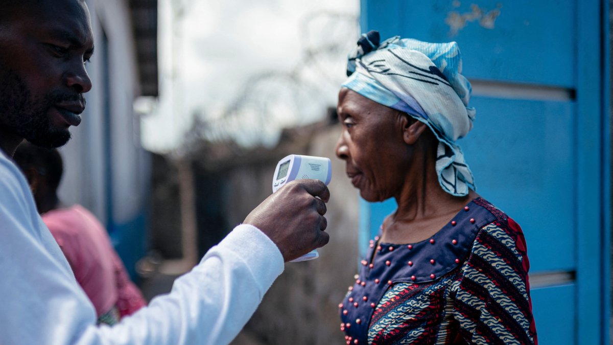 Hospital staff checks a visitor’s temperature using a contactless infrared thermometer, in Goma, DR Congo, May 17, 2026. (AFP Photo)