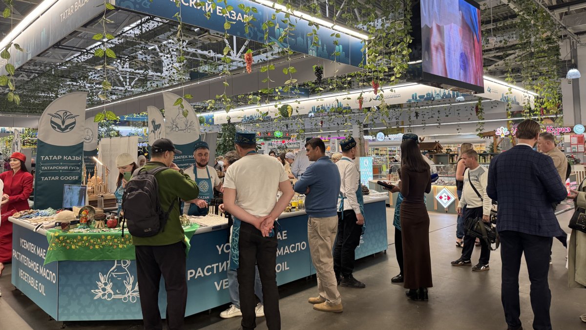 Visitors are seen close to a booth during the KazanForum 2026, Kazan, Russia, May 13, 2026. (AA Photo)