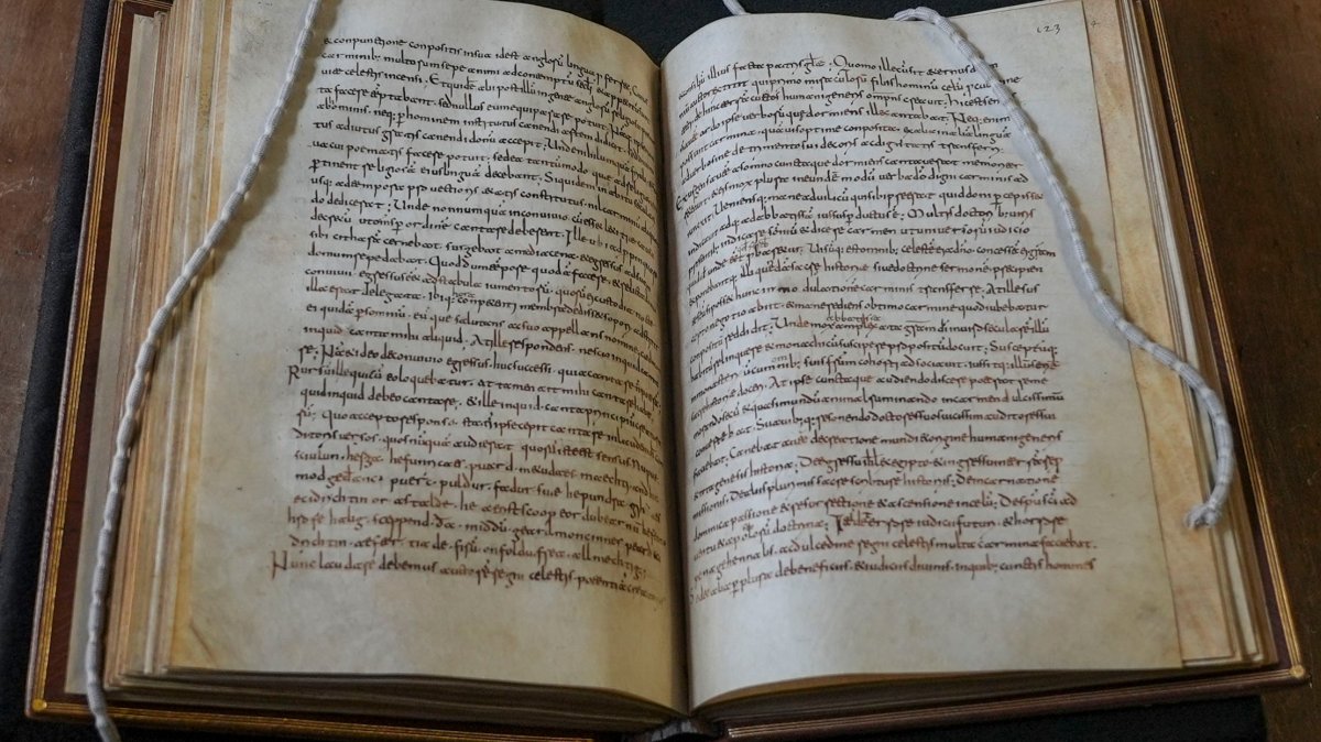 A rare, long-lost copy of "Caedmon's Hymn," the first poem ever written down in Old English, is visible in the five lines above the final line of the left page from an eighth-century manuscript copy of the Venerable Bede's Ecclesiastical History of the English People, at Rome's National Library, Rome, Italy, May 8, 2026. (AP Photo)
