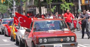 People wave Turkish flags during the 43rd Turkish Day Parade as Manhattan streets fill with celebrations and red-and-white colors, New York City, U.S, May 16, 2026. (AA Photo)