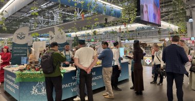 Visitors are seen close to a booth during the KazanForum 2026, Kazan, Russia, May 13, 2026. (AA Photo)