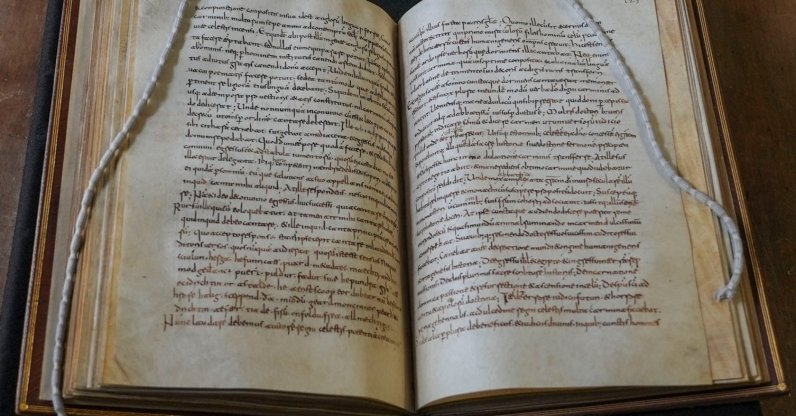 A rare, long-lost copy of "Caedmon's Hymn," the first poem ever written down in Old English, is visible in the five lines above the final line of the left page from an eighth-century manuscript copy of the Venerable Bede's Ecclesiastical History of the English People, at Rome's National Library, Rome, Italy, May 8, 2026. (AP Photo)