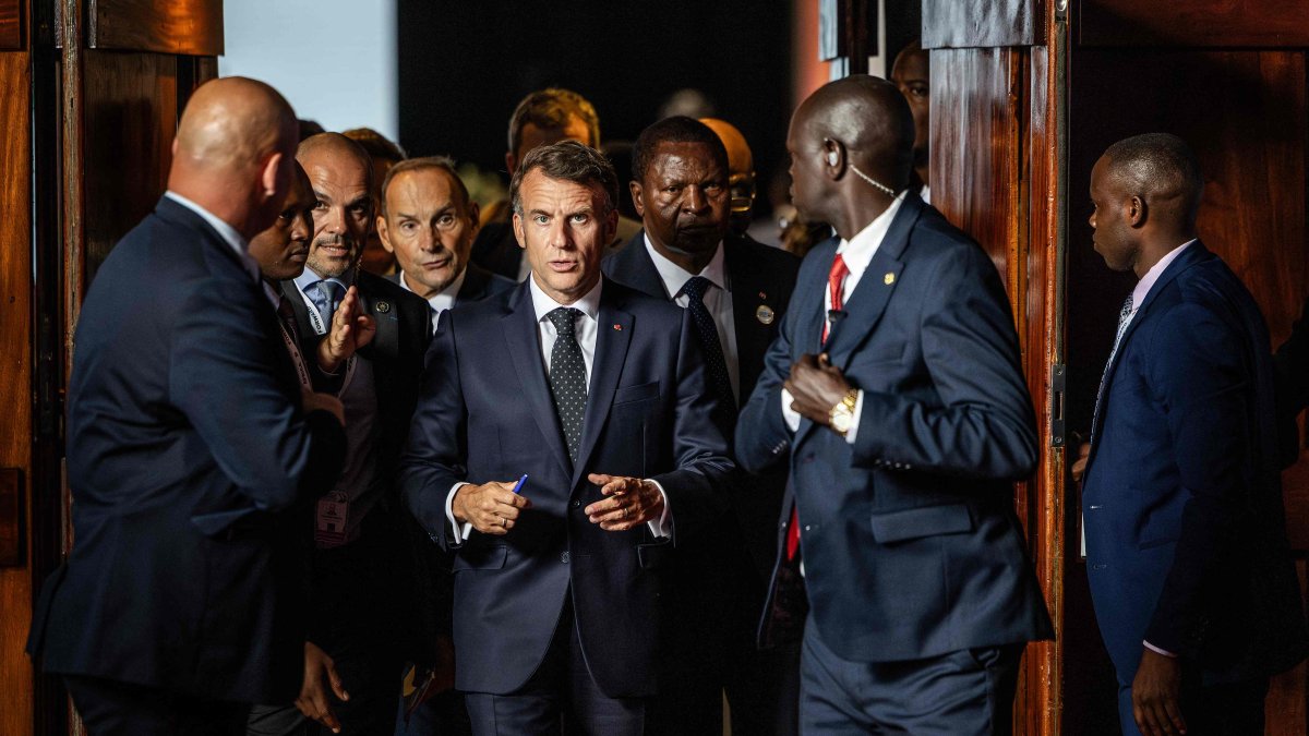 France's President Emmanuel Macron (C) and the Central African Republic's President Faustin Archange Touadera (3rd R) walk during the Africa Forward Summit at the Kenyatta International Convention Centre (KICC), Nairobi, Kenya, May 12, 2026. (AFP Photo)