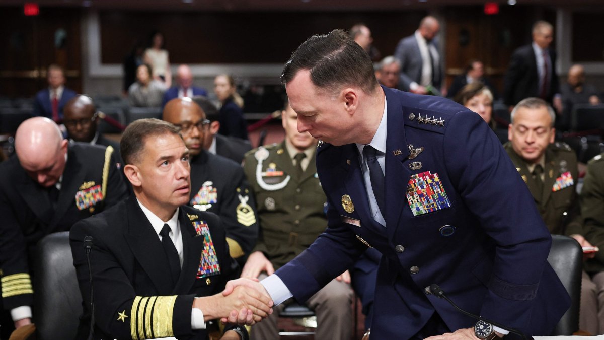 Commander of U.S. Africa Command (AFRICOM) Air Force Gen. Dagvin Anderson (R) shakes hands with Commander of U.S. Central Command (CENTCOM) Navy Adm. Brad Cooper (L) as they conclude their testimony before the Senate Armed Services Committee in the Dirksen Senate Office Building on Capitol Hill, Washington, U.S., May 14, 2026. (AFP Photo)
