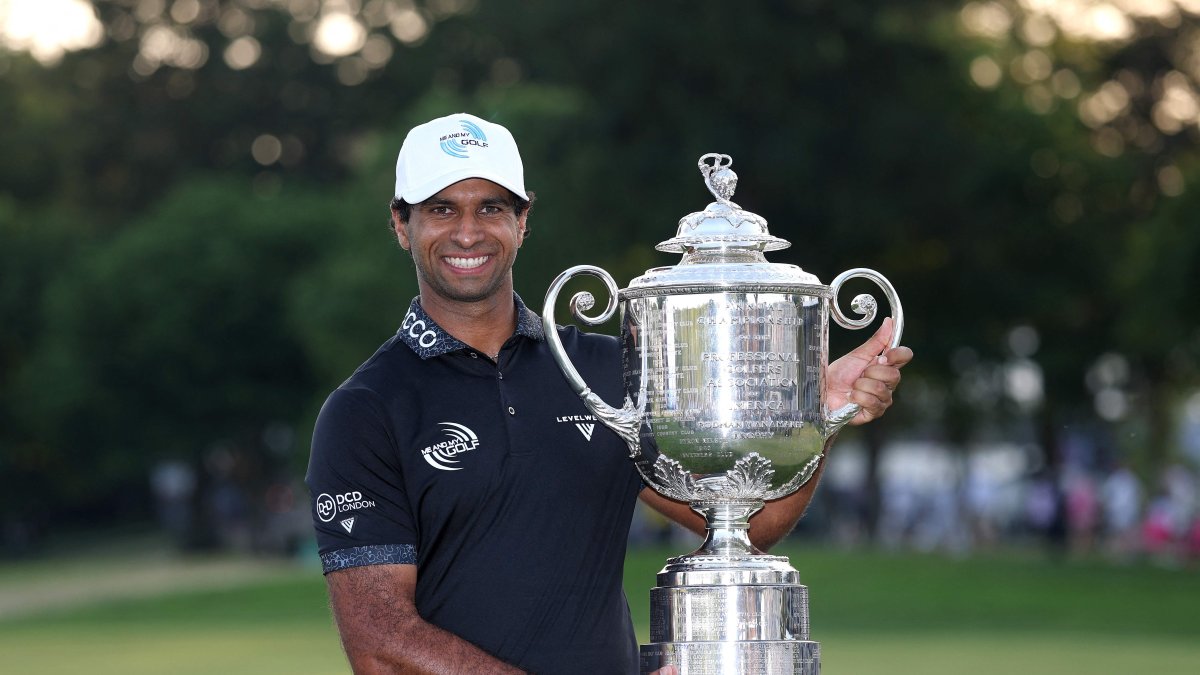 England's Aaron Rai celebrates with The Wanamaker Trophy after victory during the final round of the PGA Championship at Aronimink Golf Club, Newtown, U.S., May 17, 2026. (AFP Photo)