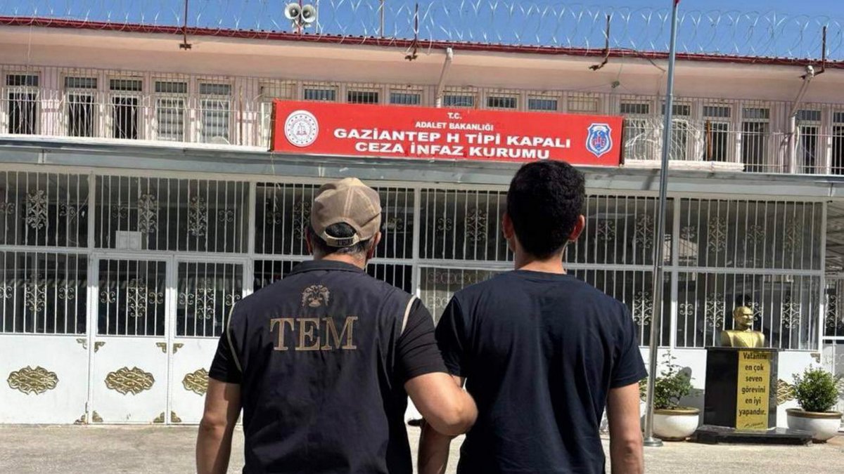 Police officers escort a convicted FETÖ member after being detained during a counterterrorism operation in Gaziantep, Türkiye, May 13, 2026. (AA Photo)