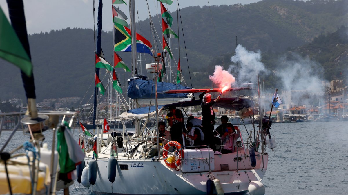 Activists from the Global Sumud Flotilla, which aims to reach Gaza and break Israel’s illegal naval blockade, light flares as they depart by boat from a port in the southern Turkish resort of Marmaris, May 14, 2026. (Reuters Photo)