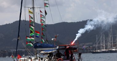 Activists from the Global Sumud Flotilla, which aims to reach Gaza and break Israel’s naval blockade, light flares as they depart by boat , Marmaris, Türkiye, May 14, 2026. (Reuters Photo)