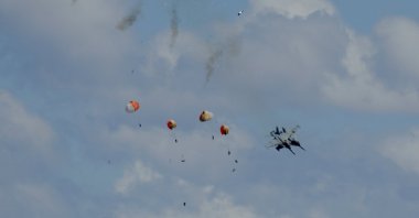 Four crew members of military jets eject safely following a mid-air collision during the Idaho air show outside Mountain Home Air Force Base in Idaho, U.S. May 17, 2026. (Henk Zuurbier/Handout via Reuters)