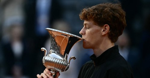 Italy's Jannik Sinner kisses the trophy after winning the men's final of the ATP Rome Open tennis tournament against Norway's Casper Ruud at the Foro Italico, Rome, Italy, May 17, 2026. (AFP Photo)