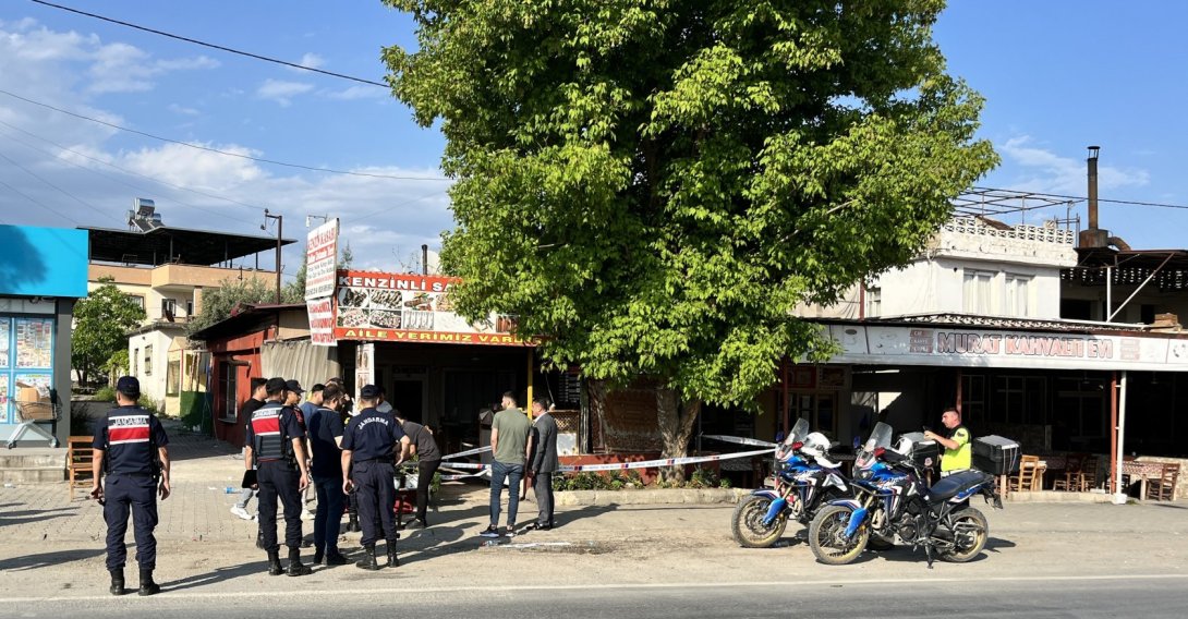 Police officers stand outside a restaurant that was the scene of a shooting that left four dead, six others injured in southeastern Mersin province, Türkiye, May 18, 2026. (AA Photo)