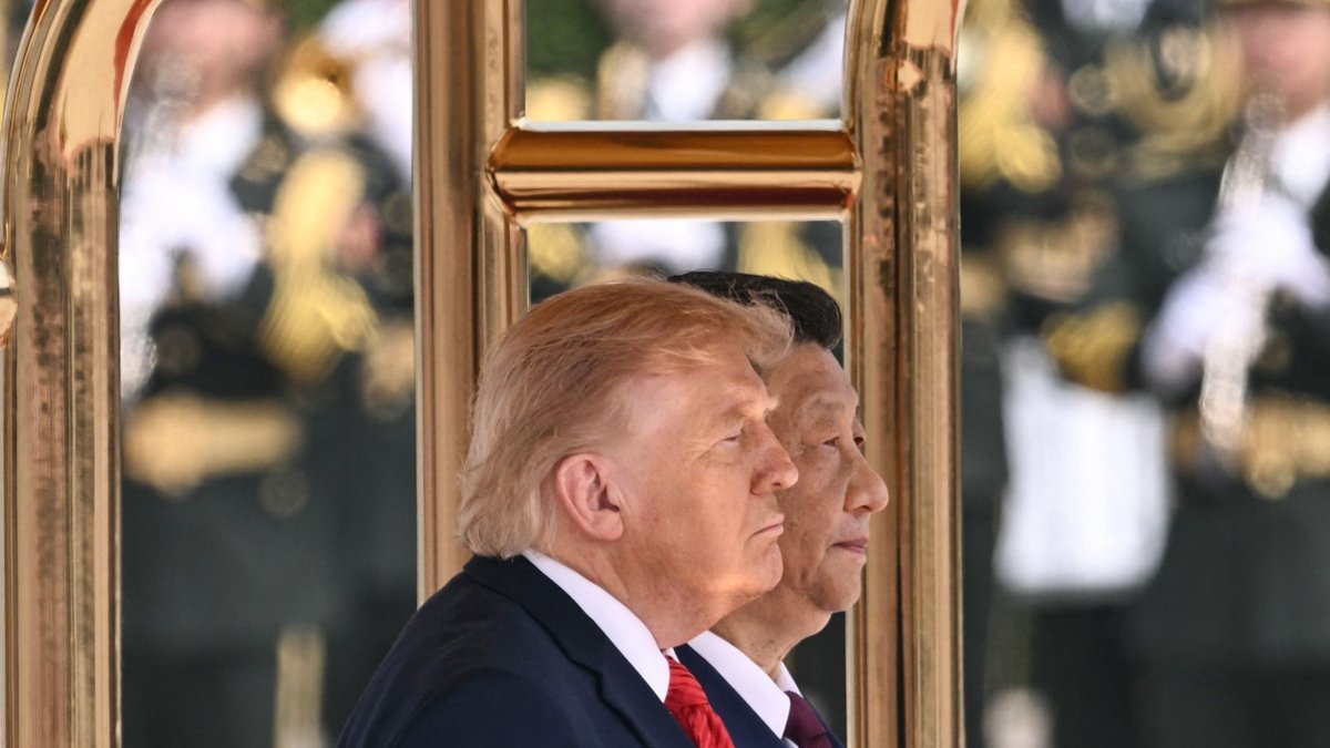 U.S. President Donald Trump (L) and Chinese President Xi Jinping stand for their countries' national anthems during a welcome ceremony at the Great Hall of the People, Beijing, China, May 14, 2026. (AFP Photo)