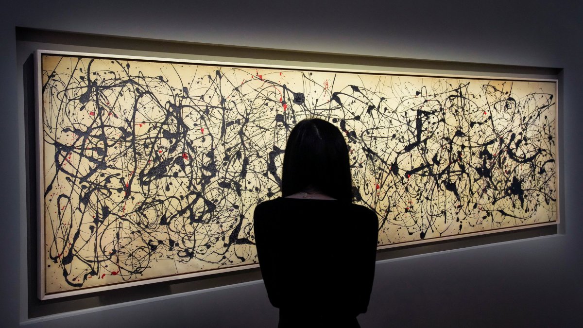 A person looks at the artwork titled "Number 7A," dated 1948 by Jackson Pollock, during the Christie's preview for the 20/21 Spring Marquee Week, New York City, U.S., May 8, 2026. (Reuters Photo)