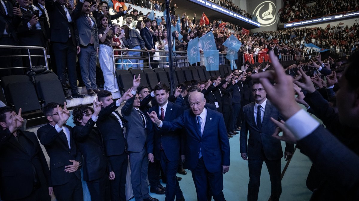 MHP leader Devlet Bahçeli makes wolf sign as he enters the venue for the event, Ankara, Türkiye, May 19, 2026. (AA Photo)