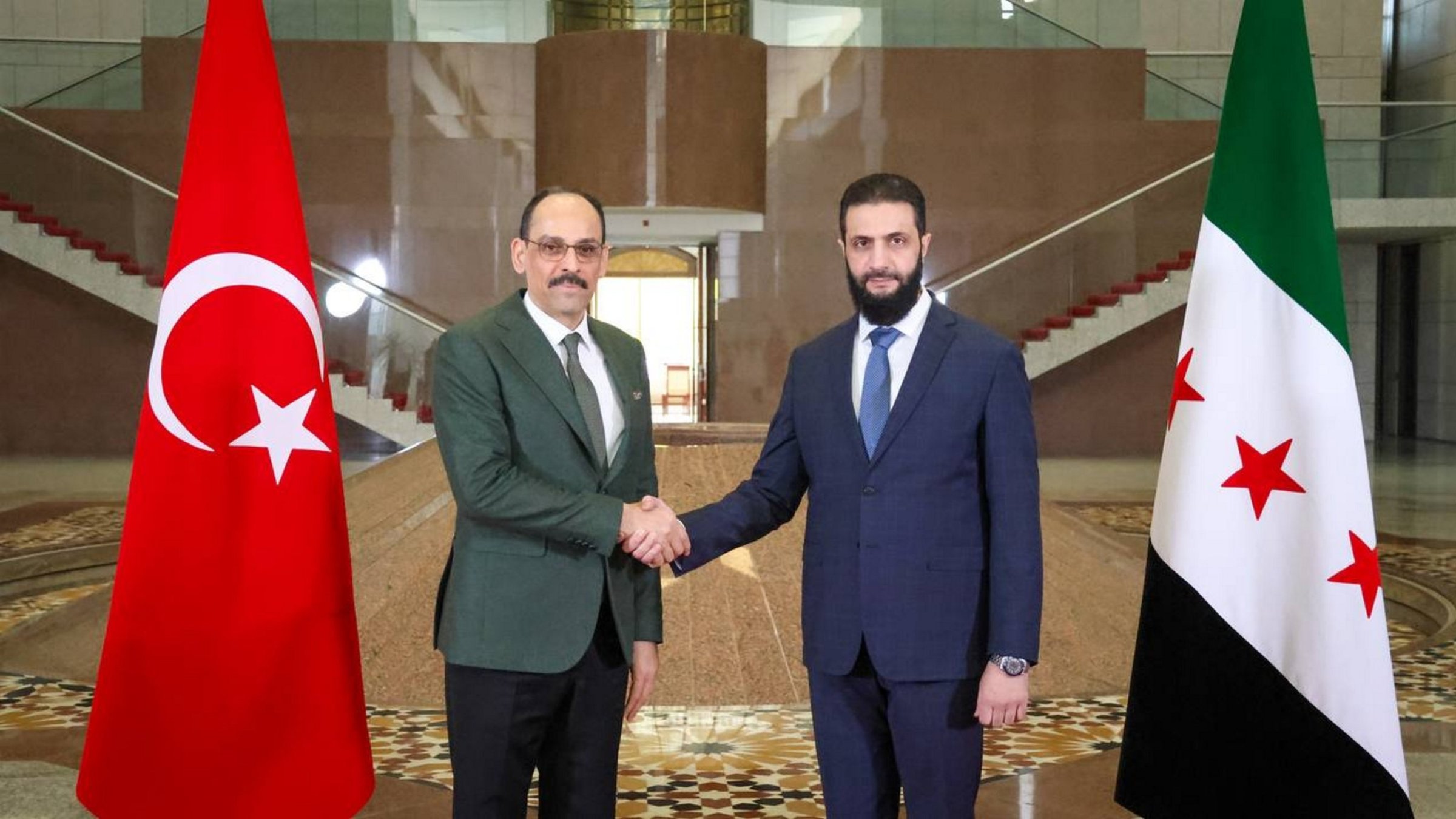 National Intelligence Organization (MIT) head Ibrahim Kalın (L) and Syria's President Ahmed al-Sharaa shake hands as part of their meeting, Damascus, Syria, Jan. 26, 2025. (AA File Photo)