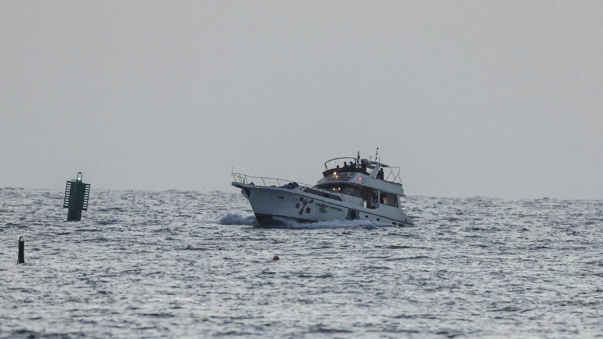 A boat bearing symbols of one of the vessels belonging to the Gaza-bound aid flotilla and attacked by the Israeli navy, is motored toward the Israeli port of Ashdod, May 19, 2026. (AFP Photo)