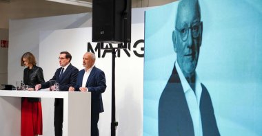 An image of the late Mango founder Isak Andic is projected as Mango Chairperson and CEO Toni Ruiz, (C) stands next to other executives at a press conference to present their 2024 financial results in Palau-solita i Plegamans, north of Barcelona, Spain, March 10, 2025. (AFP Photo)