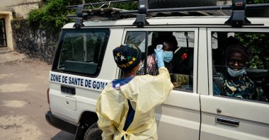 A visitor has their temperature checked by a health worker using a thermoflash before entering Kyeshero Hospital at a checkpoint in Goma, Democratic Republic of Congo, on May 18, 2026. (AFP Photo)