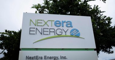 The logo of NextEra Energy is seen at the entrance of its headquarters in Juno Beach, Florida, U.S., May 18, 2026. (AFP Photo) 