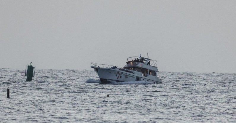 A boat bearing symbols of one of the vessels belonging to the Gaza-bound aid flotilla and attacked by the Israeli navy, is motored toward the Israeli port of Ashdod, May 19, 2026. (AFP Photo)