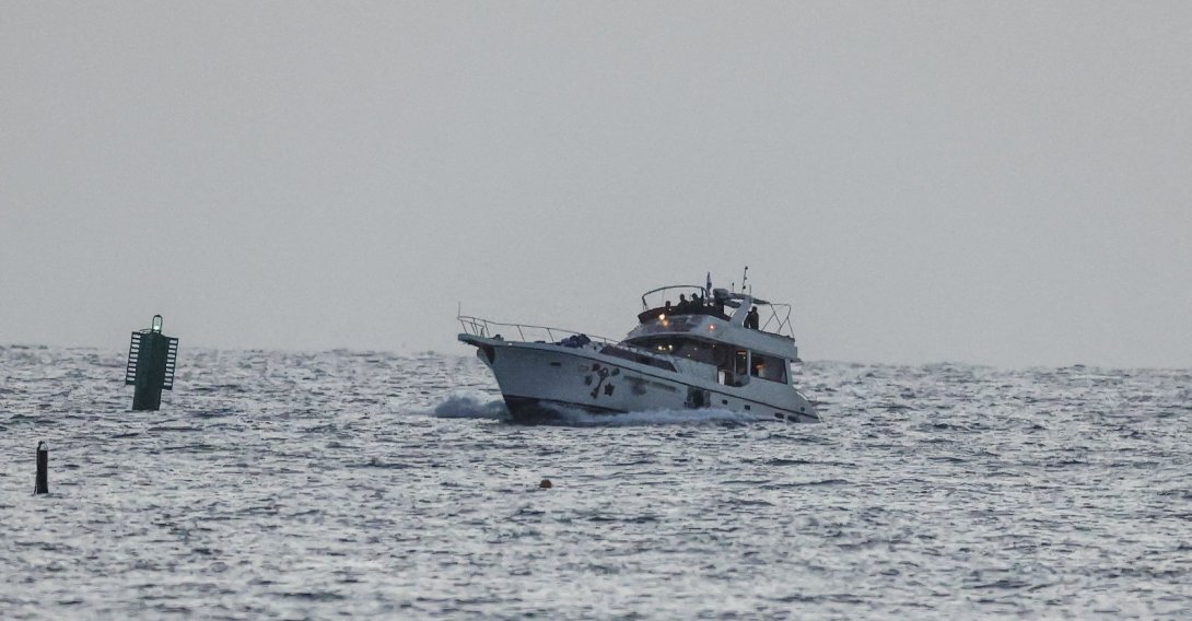 A boat bearing symbols of one of the vessels belonging to the Gaza-bound aid flotilla and attacked by the Israeli navy, is motored toward the Israeli port of Ashdod, May 19, 2026. (AFP Photo)