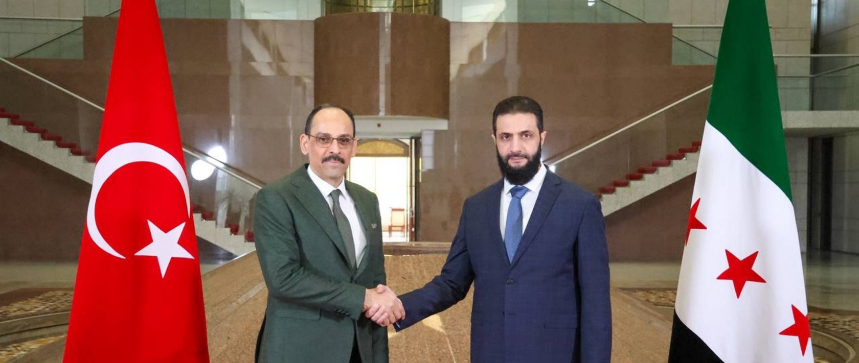 National Intelligence Organization (MIT) head Ibrahim Kalın (L) and Syria's President Ahmed al-Sharaa shake hands as part of their meeting, Damascus, Syria, Jan. 26, 2025. (AA File Photo)