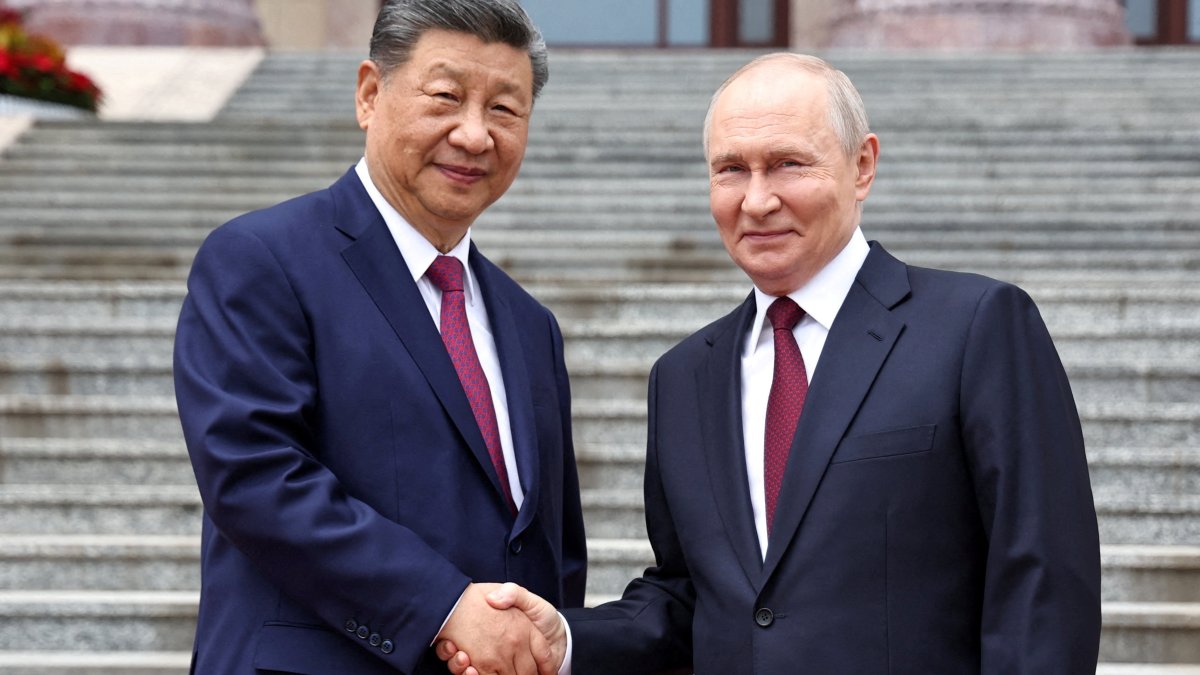 Russian President Vladimir Putin shakes hands with Chinese President Xi Jinping during a welcoming ceremony at the Great Hall of the People in Beijing, China, May 20, 2026. (Reuters Photo)
