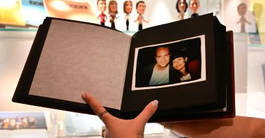 A photo album given by U.S. actor Jennifer Aniston to fellow "Friends" cast members Matthew Perry and Courtney Cox is displayed ahead of "The Matthew Perry Estate Auction" at Heritage Auctions in Beverly Hills, California, U.S., May 19, 2026. (AFP Photo)