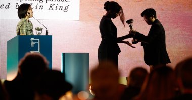 Yang Shuang-zi (R), author of 'Taiwan Travelogue,' accepts the award of the 2026 International Booker Prize from Chair of Judges Natasha Brown (C) at the Tate Modern, London, U.K., May 19, 2026. (EPA Photo)