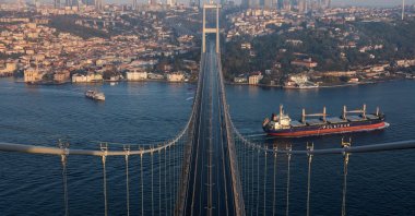 A tanker sails under the July 15 Martyrs&amp;#039; Bridge with a view of Istanbul&amp;#039;s business and financial districts, Istanbul, Türkiye, Nov. 2, 2025. (Reuters Photo)