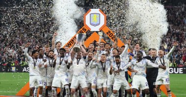 Aston Villa's John McGinn lifts the trophy as he celebrates with teammates after winning the UEFA Europa League at Tüpraş Stadium, Istanbul, May 21, 2026. (Reuters Photo)