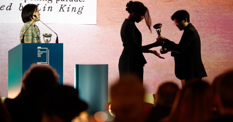 Yang Shuang-zi (R), author of 'Taiwan Travelogue,' accepts the award of the 2026 International Booker Prize from Chair of Judges Natasha Brown (C) at the Tate Modern, London, U.K., May 19, 2026. (EPA Photo)