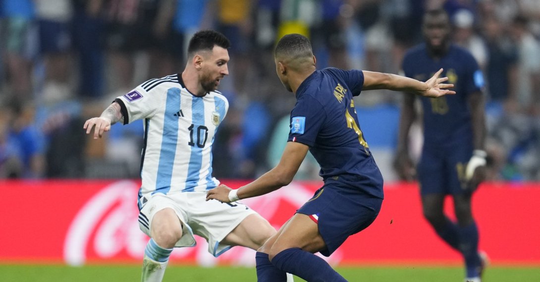 Argentina's Lionel Messi dribbles challenged by France's Kylian Mbappe during the World Cup final match between Argentina and France at the Lusail Stadium, Lusail, Qatar, Dec. 18, 2022. (AP Photo)