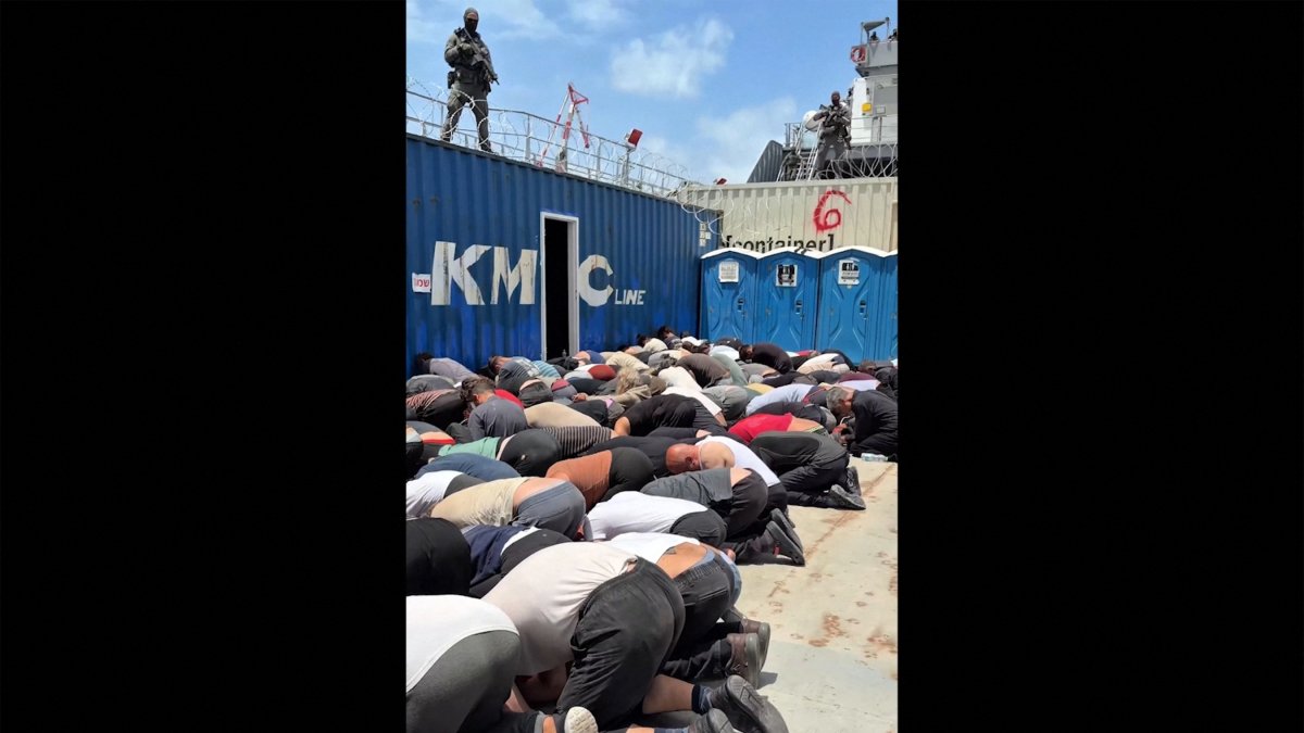 This screen grab taken from footage released on Israeli National Security Minister Itamar Ben Gvir’s X account shows dozens of detained activists from the Gaza-bound aid flotilla kneeling with their hands tied behind their backs and their foreheads on the ground on the deck of a military boat in Israel, May 20, 2026. (AFP Photo)
