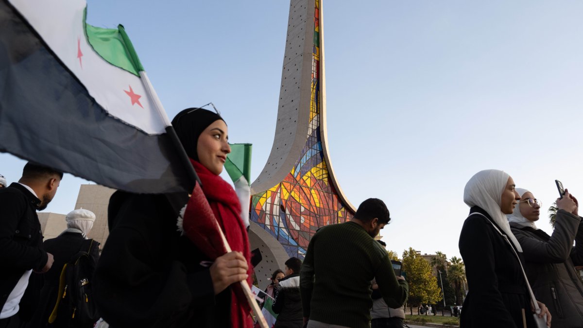 Syrians gather at the city center to celebrate one year since the fall of the Assad regime, Damascus, Syria, Dec. 7, 2025. (Getty Images Photo)